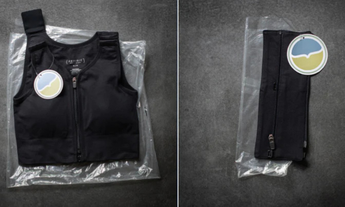 Black front-zip compression bra and a folded zip garment in thin clear bags with round tags, minimal packaging